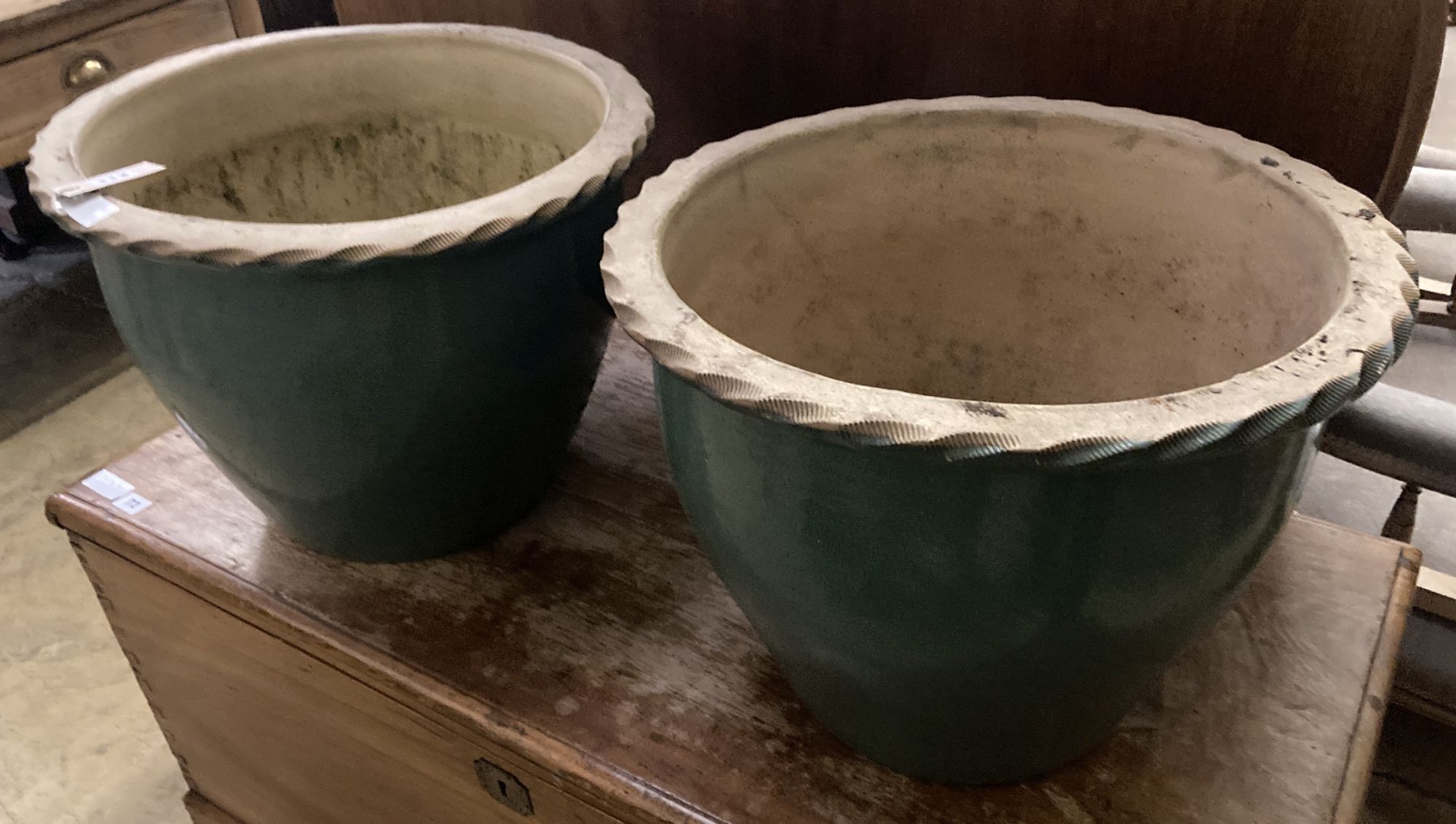 A pair of circular glazed earthenware garden planters, 48cm diameter, height 36cm